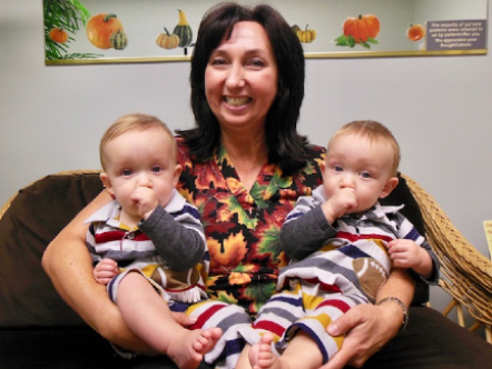 Dr. Tracey holding twins